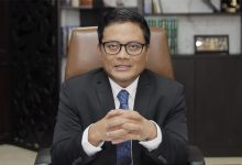 Potret profil profesional tokoh perbankan, kader Muhammadiyah yang sedang menghadapi persoalan hukum terkait kasus kredit Sritex.