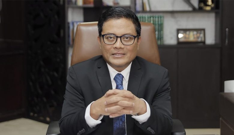 Potret profil profesional tokoh perbankan, kader Muhammadiyah yang sedang menghadapi persoalan hukum terkait kasus kredit Sritex.