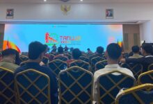 Suasana forum Tanwir XXXIV IMM di Banten yang memperlihatkan peserta sidang dan layar videotron berlogo Tanwir XXXIV.