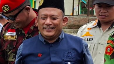 Iskandar Muda Hasibuan tersenyum saat menghadiri kegiatan konsolidasi internal Majelis Dikdasmen PWM Aceh di Bener Meriah.